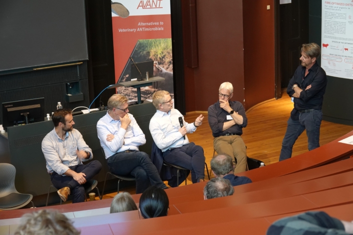 Panelists at the AVANT PIG-PARADIGM Final Stakeholder Event Four panelists and a moderator engaged in a discussion in front of the AVANT Project roll-up